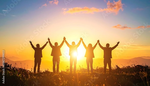 Friends standing together at sunset outdoors.