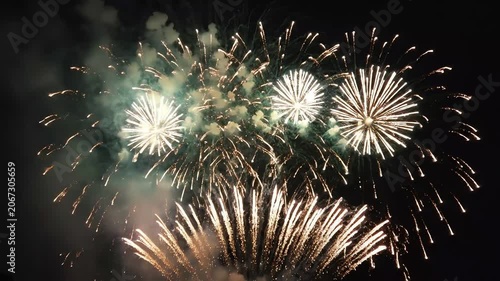 Vibrant fireworks display exploding in the dark night sky. 4K Video