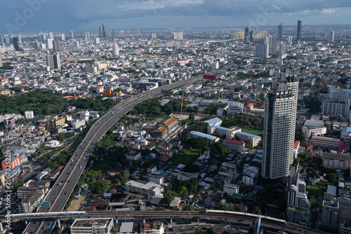 Aerial view of Bangkok cityscape with elevated highway and skyscrapers