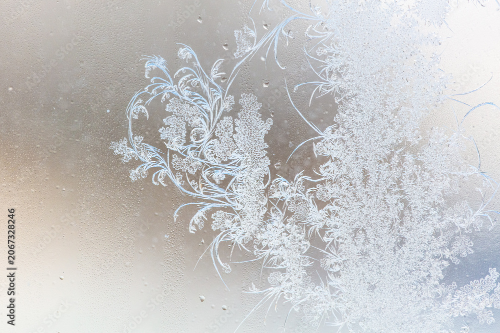 Fototapeta premium Frost pattern on window glass as background