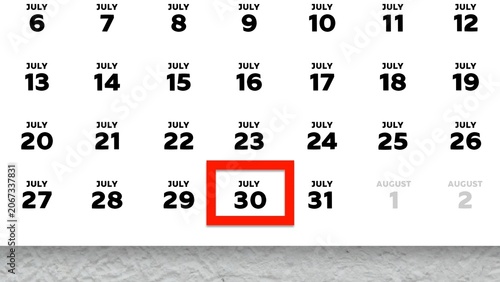 Close-up of July 30th date marked with a red cursor on a 2026 wall calendar