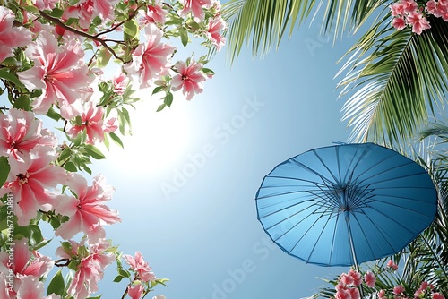 Tropical beach with palm trees under a blue sky by the ocean on a sunny summer day