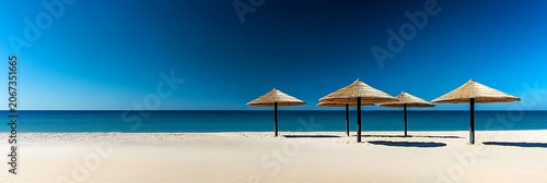Tropical beach with colorful umbrellas on sandy shore by the ocean under a sunny sky