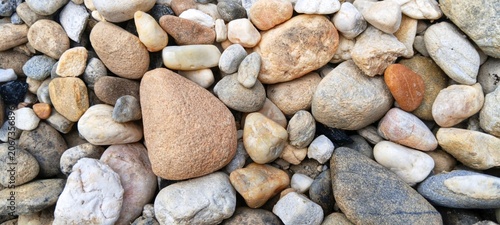 фотографія Eco-friendly product background concept featuring raw unpolished river gravel, p