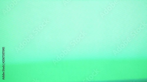 Green tv signal static texture for design projects needing vintage technology aesthetic. Ideal for backgrounds, overlays, and digital media projects.