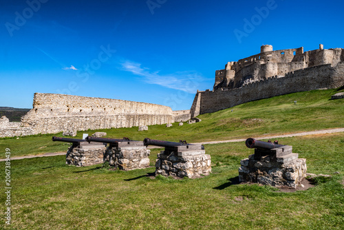 Ancient cannons guarding the lower grounds of Spis Castle on a sunny day in Slovakia