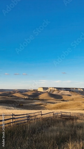 Rolling hills under clear blue sky