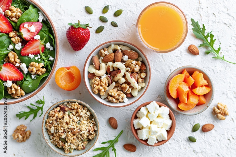Fototapeta premium Healthy salad with strawberry quinoa nuts and cheese for a fresh organic breakfast