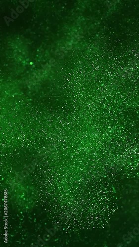 Green glitter background effect, vertical video featuring shimmering sparkling particles, elegant festive motion and luxurious abstract light animation