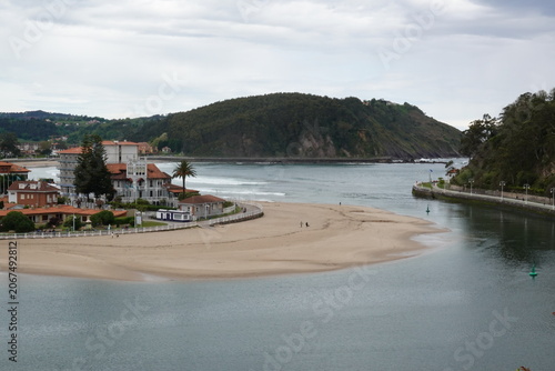Panoramic view of Ribadesella town and estuary in Asturias, vintage style with empty space for Northern Spain travel design and nostalgic cinematic tourism