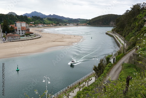 Panoramic view of Ribadesella town and estuary in Asturias, vintage style with empty space for Northern Spain travel design and nostalgic cinematic tourism
