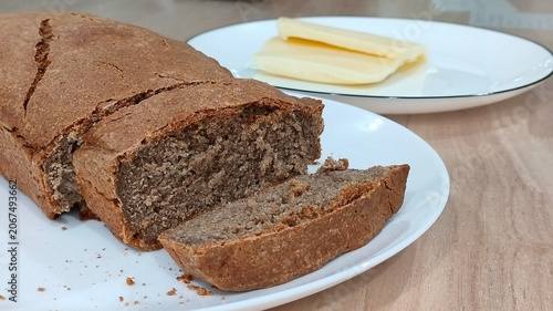 Homemade Rye Bread Loaf with Cheese on Table