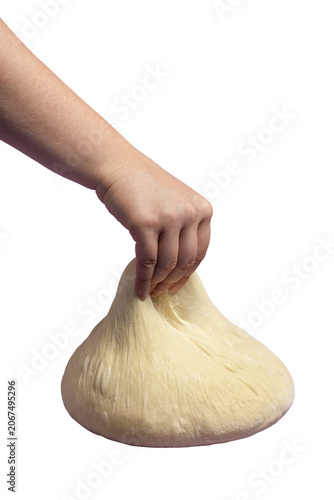 Bread dough isolated on purple color. Woman hand stretching the dough. Home baking