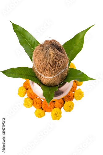 Copper Kalash decorated with flowers, mango leaf and coconut for Hindu Puja