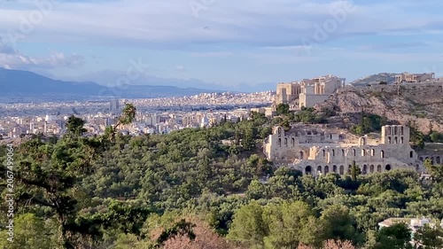 Athens pan across cityscape past Parthenon temples on Acropolis Greece