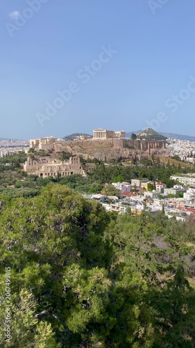 Athens vertical video over city rooftops to Acropolis Parthenon Greece