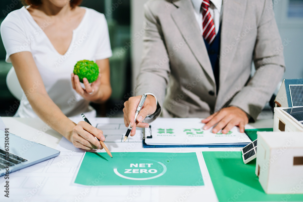 Fototapeta premium business team people planning and discussing on recycle reduce reuse policy symbol in office meeting room. Green business company and Solar Energy Environment city Concept.
