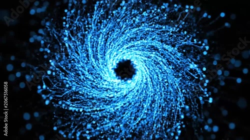 Circular blue light particle vortex against black background.