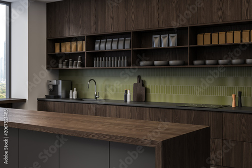 Quadro em tela Modern kitchen interior featuring dark wood cabinets, open shelving, green tile backsplash, and refined minimalist details within contemporary architecture
