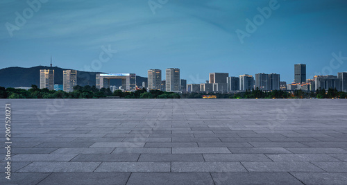 Serene Evening View of a Modern Urban Skyline with Clear Blue Sky