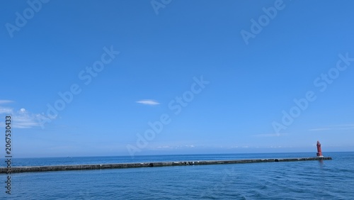 Quadro su tela Red breakwater lighthouse at Otaru Port 2