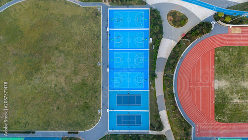 Outdoor Sports Complex Aerial View with Tennis Courts, Running Track and Lawn Field