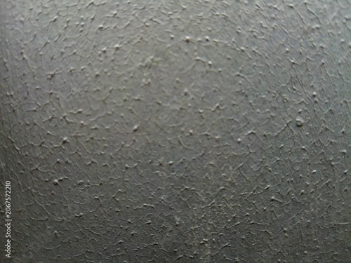 Close up of cracked gray paint texture on wall surface background 