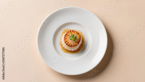 Perfectly caramelized scallop centered on a white porcelain plate with delicate herb garnish in a minimalist Michelin-style fine dining composition.