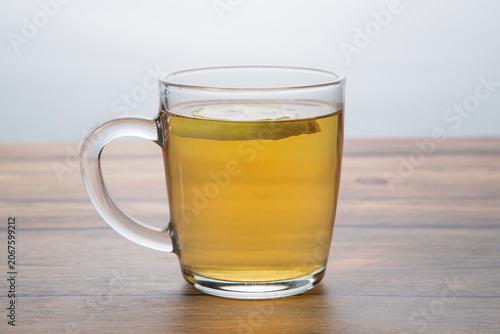 Green tea in a mug with lemon