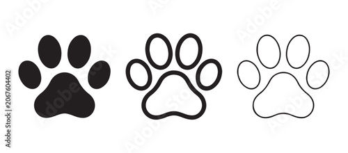 Obraz na plátně animal paw prints in black on a white background for use as icons or graphics  p