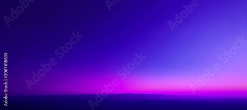 Vibrant purple and pink sunset over serene ocean horizon