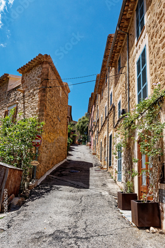 Old street in historic town of Deia in the mountains of Mallorca, Spain