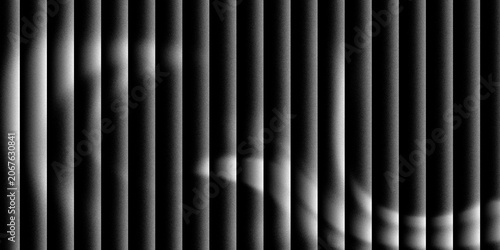 Tableau sur toile Light passing through venetian blinds, casting stripes of light and shadow with subtle hints of color