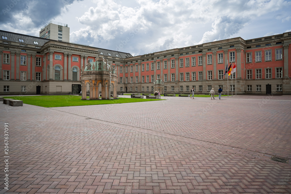 Obraz premium Inner courtyard of City Palace with classical architecture and domed pavilions, Potsdam, Germany