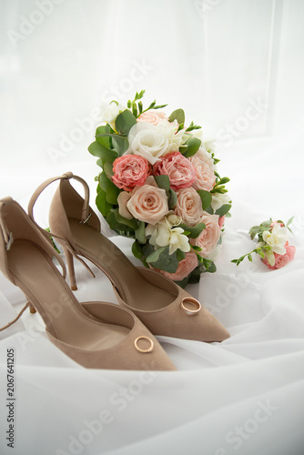 Bride's shoes and wedding bouquet