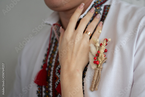 bride and groom in embroidered Ukrainian dresses. A beautiful bouquet
