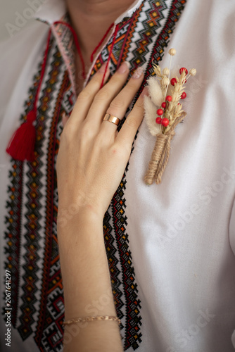 bride and groom in embroidered Ukrainian dresses. A beautiful bouquet