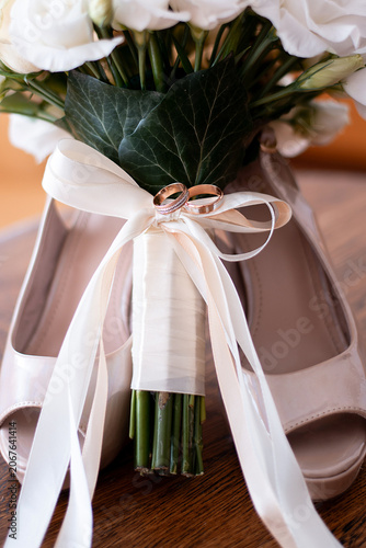Bride's shoes and wedding bouquet