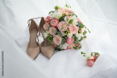 Bride's shoes and wedding bouquet