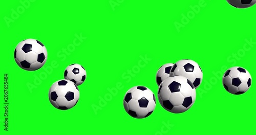 Falling soccer balls bounce across green screen backdrop for sports editing, highlighting realistic movement and classic black white patterns for high quality video production projects.