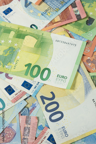 Fotografie Wealth and economy concept with Euro cash wallpaper.