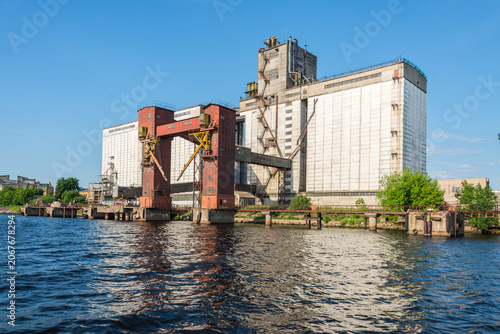 Riga Port Industrial Area with Cargo Cranes, Ships and Daugava River, Latvia