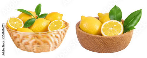 Ripe lemons in wicker basket and wooden bowl isolated on white background