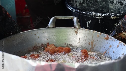 Deep Frying Crispy Chicken in a Large Metal Wok