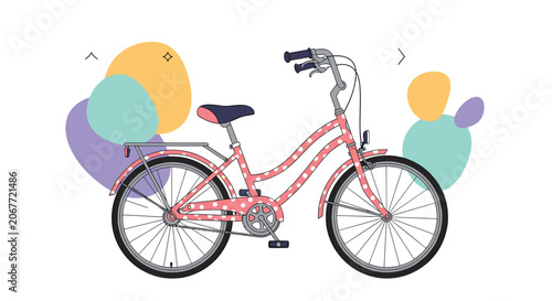 Stylish pink bicycle decorated with white polka dots and a rear rack positioned against colorful abstract shapes and patterns.