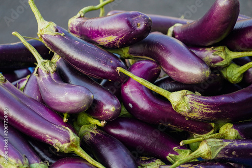 a pile of fresh purple aubergines