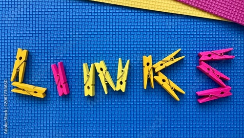 Fotografija "Links" word composed with letters shaped by clothes pegs on checkered textured