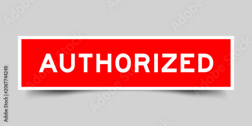 Red color square shape sticker label with word authorized on gray background