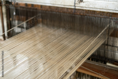 Canvastavla Close up view of stretched warp threads on a traditional wooden handloom