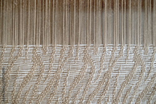 Принти на полотні Macro close up of the weaving point where warp and weft threads interlock to create beautiful wavy tenun fabric patterns
